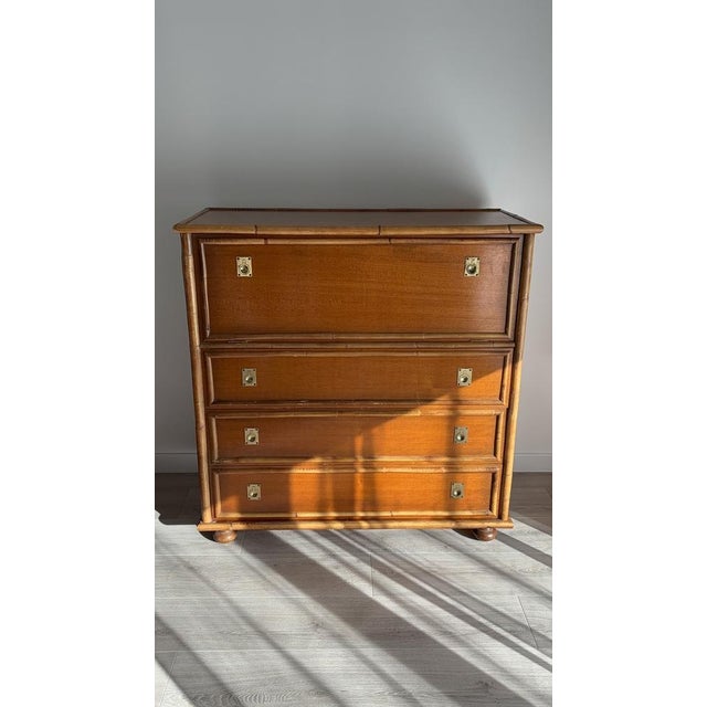 Beautiful 1970s chest of drawers in wood and bamboo. It can be used as a chest of drawers or a bar cabinet with its three...