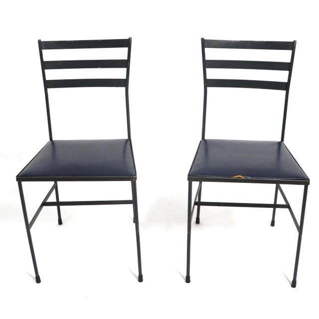Pair wrought iron side, or dining chairs in the style of McCobb, Nelson, Arbuck etc. The chairs have drop in seats, with...