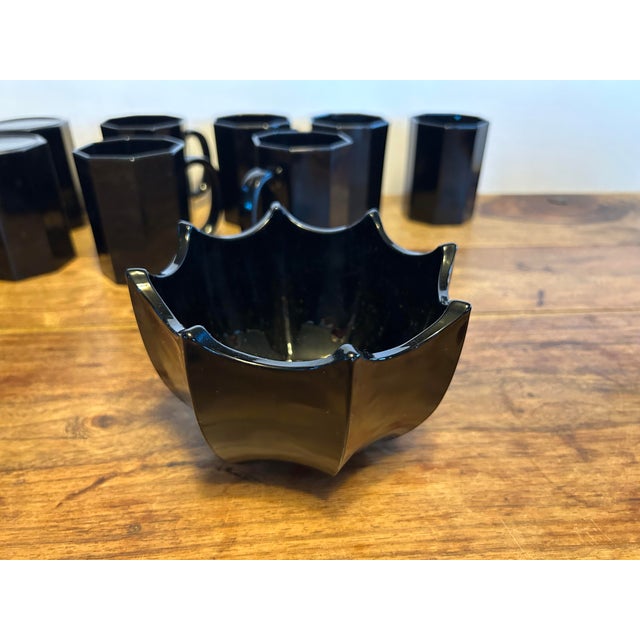 Lovely pair of black glass bowls. They are truly a unique shape and style with scalloped edges. Made in France in the...