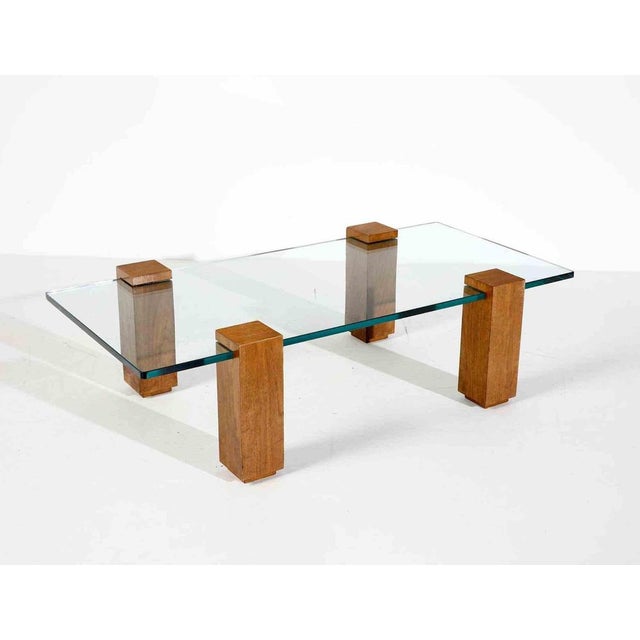 Coffee table is a table designed by Edoardo Detti, Italy 1960s. Dimensions: Cm 140,00 x 39,00 x 73,00. Glass and wood....