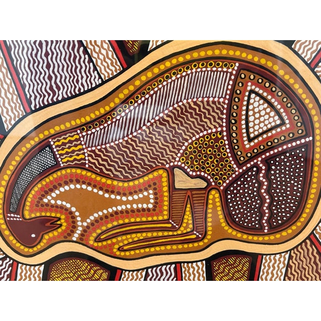 Australian Aboriginal Geometric Dot Painting Emu Dreamtime Signed Bidirrwi '89. This framed artwork is an example of...