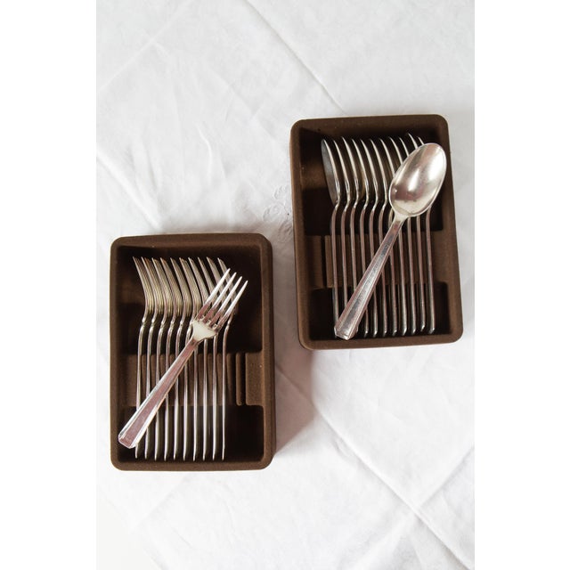 They are from the Apollo brand. Metal with 84 silver plating.