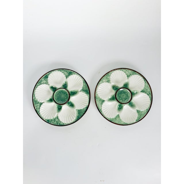 These are the dimensions of a single plate. Charming pair of French majolica oyster plates featuring six shell-shaped...
