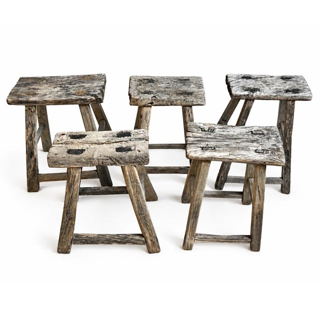 These vintage Chinese elm stools carry the quiet strength of utilitarian craftsmanship, each one shaped by time and use...