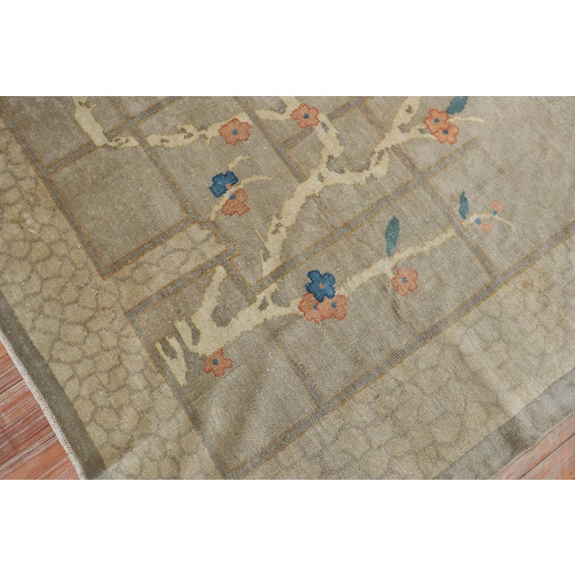 Beautiful early 20th century Chinese rug with a lovely floral pattern on a gray field Measures: 6'2'' x 8'8''.