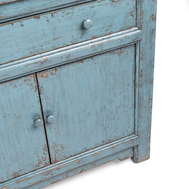 Crafted from reclaimed pine and finished in a beautifully distressed blue patina, this substantial sideboard brings...