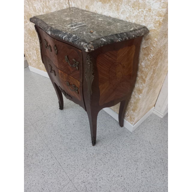 Cabinet with 2 drawers in various wood veneer equipped with original bronze handles, finished with fine marble. Very...