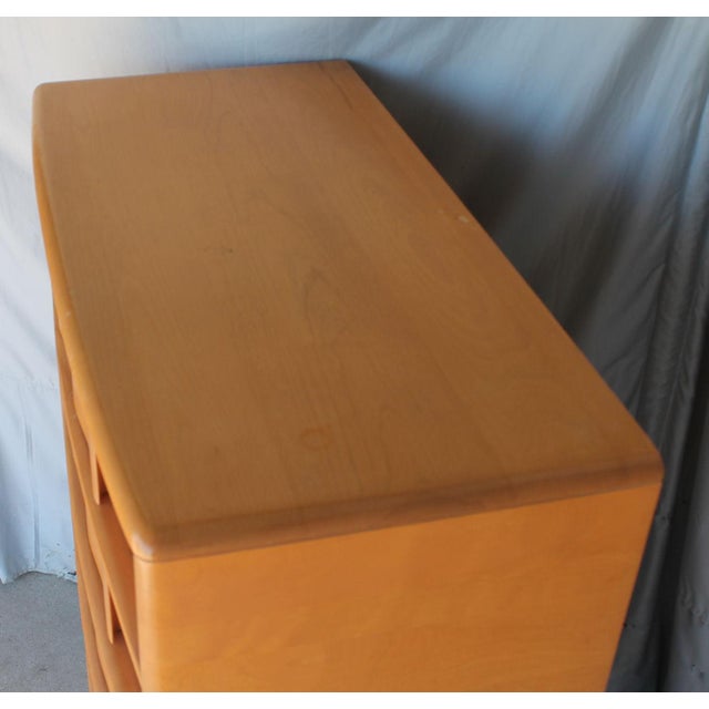 Mid Century Modern Heywood Wakefield Tall chest featuring 5 drawers with built-in sculpted curved pulls resembling folded...