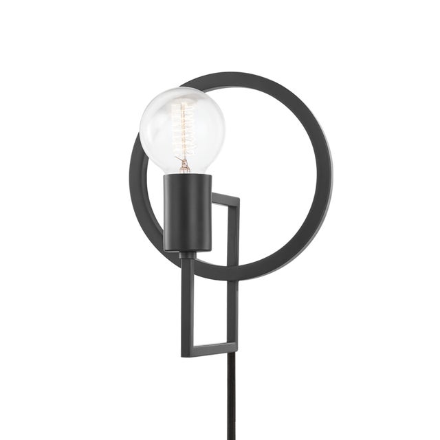 Tory uses negative space to make a positive impact. A circular backplate, square arm and cylindrical socket combine to...