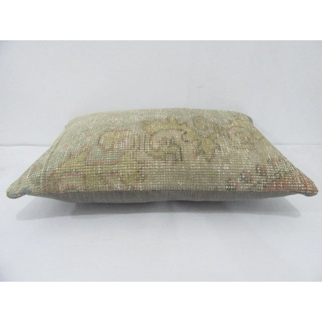 Decorative pillow cover made from a vintage Turkish handknotted rug. Backed with good quality cotton fabric. Pillow...