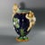Minton Majolica vase which features climbing cherubs and water lilies. Cobalt blue ground version. Colouration: cobalt...