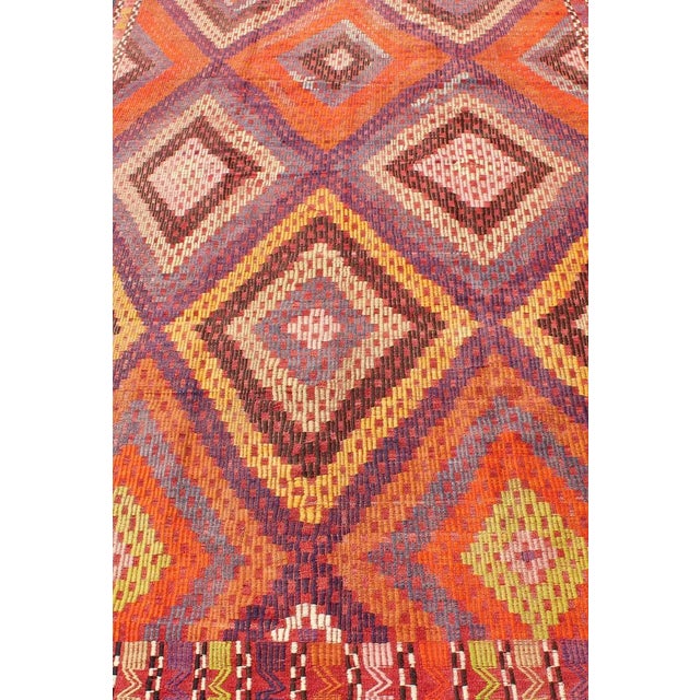 Tribal Mid 20th Century Hand Woven Vintage Turkish Embroidered Kilim Rug in Vivid Colors of Purple and Orange For Sale - Image 3 of 13