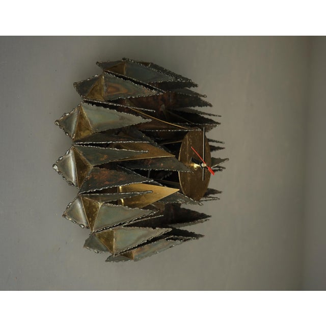An unusual Brutalist 1980s artisan made clock that almost becomes an abstract wall sculpture. Hand made from welded steel...