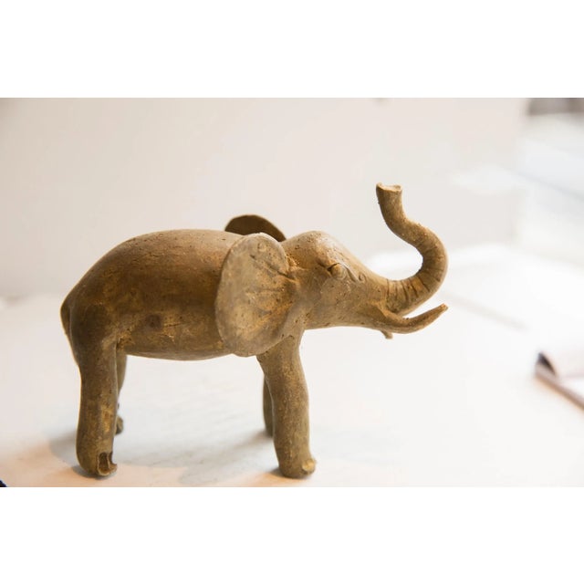 :: Vintage handmade African elephant sculpture. Circa late mid 20th century, though possibly older, this piece has such...