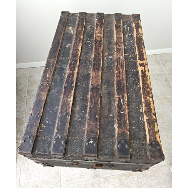 Antique late 1800's wood and canvas flat top steamer trunk. This piece was used by my great grandmother when she came to...