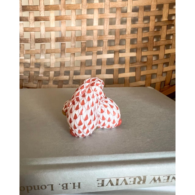 A collectible treasure from the Herend Porcelain Manufactory, this Rust Fishnet Bunny Pair features the iconic hand-...