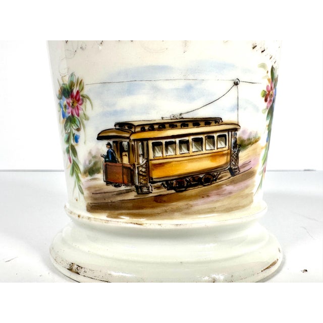 Rare & Original Hand Painted Trolley Conductor Occupational Porcelain Mug for your consideration. The mug measures approx....