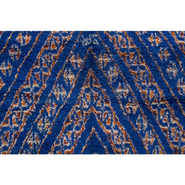 Hand-knotted in wool and originating circa 1950-1959, this 6x9 vintage Moroccan berber rug joins Rug & Kilim’s Moroccan...