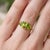 Celebrate love and vibrant elegance with this exquisite Dual Heart Peridot Ring, a beautifully crafted piece that...