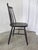 Vintage wooden dining chair in Ilmari Tapiovaara design. The chair is made from solid beech wood in black. Special...