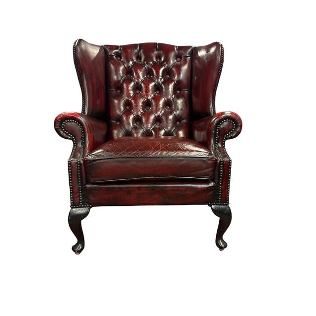 Beautiful Patina! Classic English wingback armchair upholstered in deep button-tufted oxblood leather. Traditional...