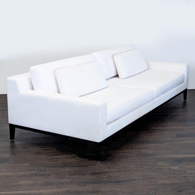 This stylish 3-seat sofa features a crisp white fabric and sleek bronze legs. With its clean lines and comfortable back...