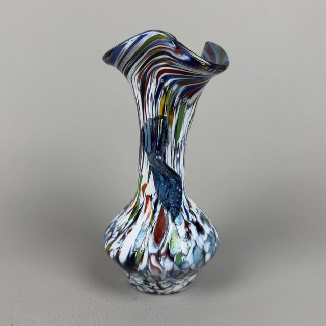 A colorful and eccentric collectible vase from the historic Fratelli Toso glassworks, renowned for its masterful use of...