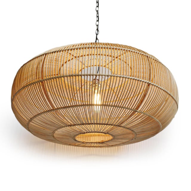 Handwoven pendant light made from finely split rattan with a low-profile silhouette that feels both airy and...