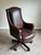Exceptional Hancock & Moore “Dillon” swivel tilt chair upholstered in rich walnut brown leather with classic wingback...