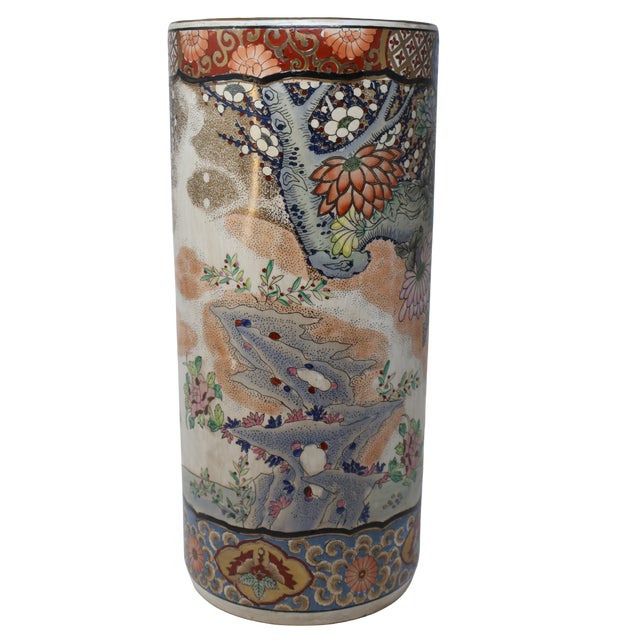 An intricately decorated porcelain umbrella stand that brings the richness of a painted garden into the interior. Hand-...