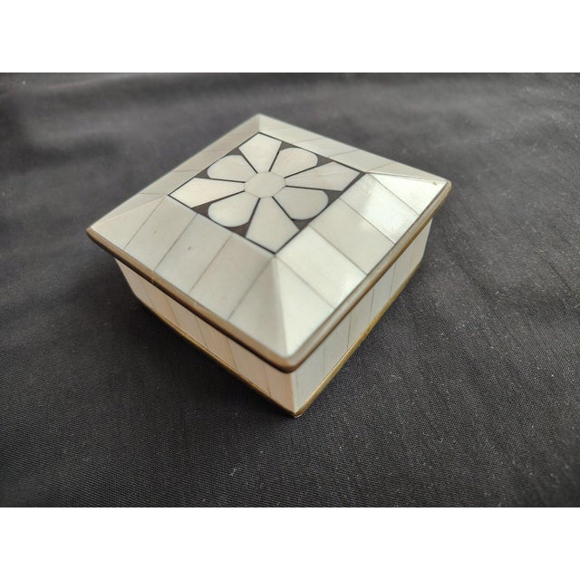 Vintage Handcrafted Bone Inlay and Brass Trim Trinket Box Elevate your vanity or bookshelf with this exquisite vintage...