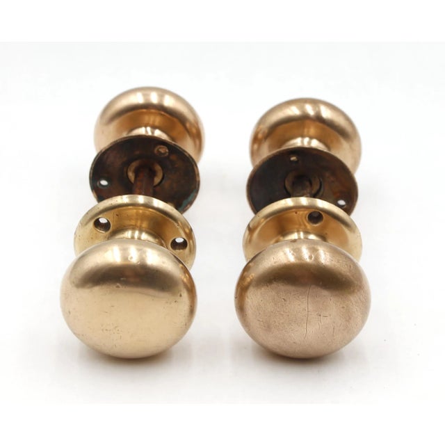 Vintage Classic door knob sets made of brass with patina. The manufacturer is unknown. Each set includes two door knobs,...