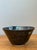 This exquisite studio pottery bowl is a masterclass in mid-century artisanal craftsmanship, blending organic form with a...