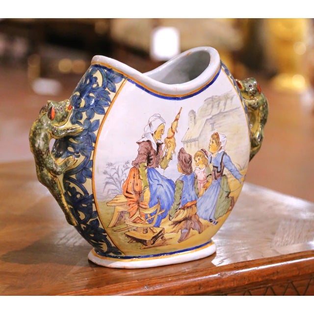 Elevate a shelf, console, or cabinet with this charming antique Quimper faience vase, crafted in Brittany circa 1895...