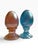 Beautiful vintage pair of iridescent art glass eggs in complementary pink/amber and aqua blue tones. Each egg features a...