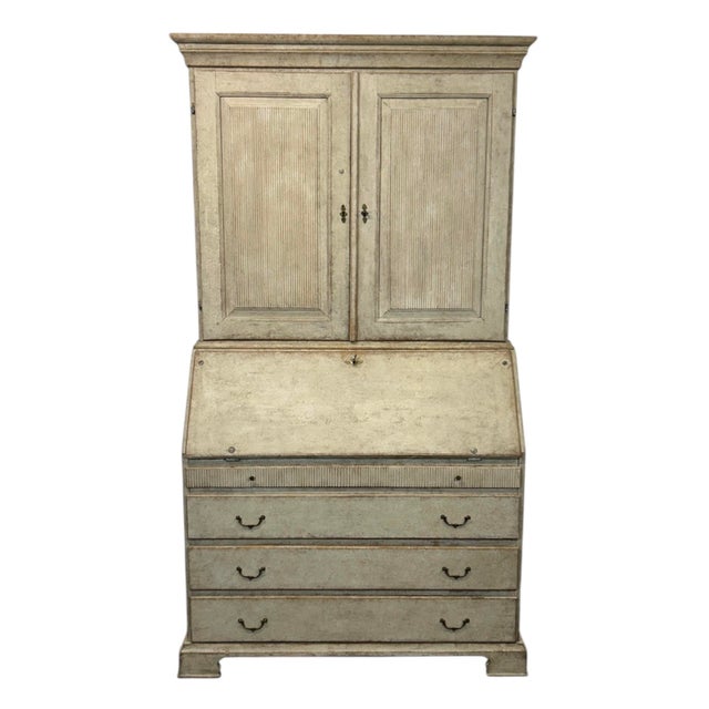 A spectacular early 19th century secretary desk made in Sweden in the Gustavian style. It features reeded raised door...