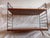• Design: Designed by Nisse and Kajsa Strinning (first presented in 1949). • Materials: Teak-veneered wooden boards and...