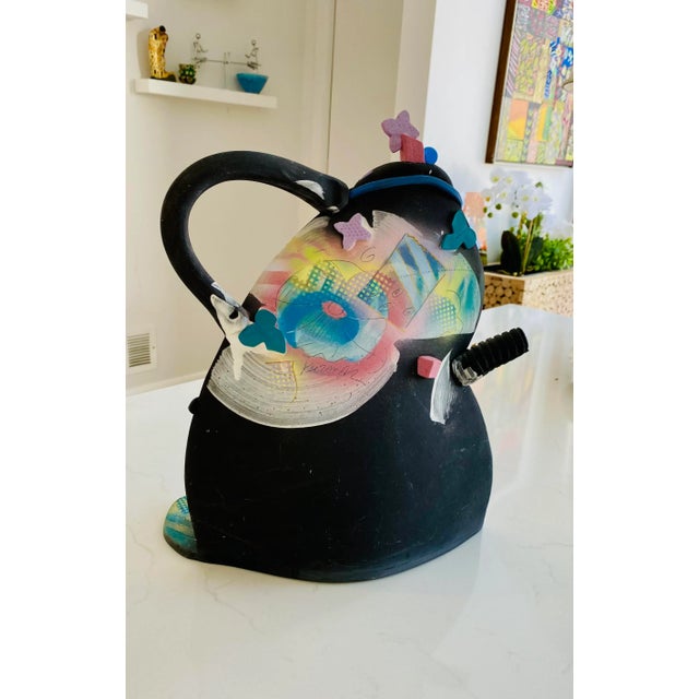 This beautiful postmodern Memphis style tea pot is signed and designed by Madeline Kaczmarczyk. This piece is one of...