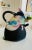This beautiful postmodern Memphis style tea pot is signed and designed by Madeline Kaczmarczyk. This piece is one of...