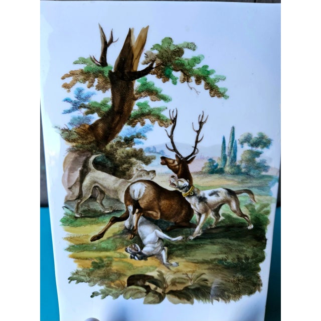 Amazing antique KPM ceramic tile depicting dogs surrounding a dear, Hunt scene. Circa 1790-1810. Measurements 9.1/4” tall...