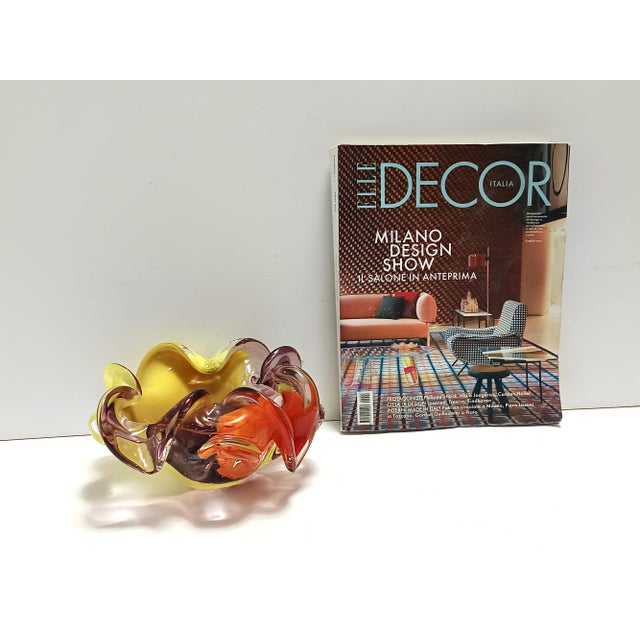 Made in Italy, 1960s. This flower-shaped ashtray / catchall is made in hand-modeled yellow, coral red and clear purple...