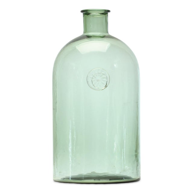 Add a touch of sophistication to your home or garden with the Sage Glass Bottle Neck Vase. The unique bottleneck design...