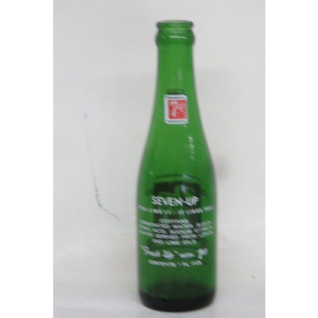 This 7up bottle made out of glass and it has green color. The bottle would be great for decoration such as a vase to keep...