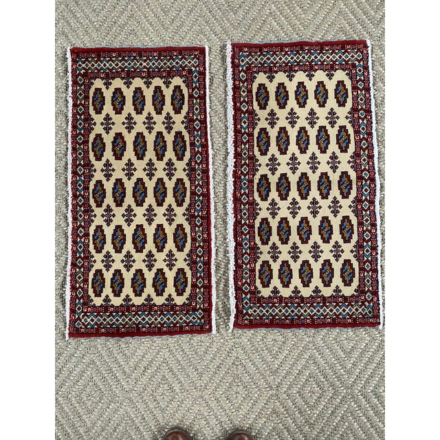 Nice pair of vintage Persian tribal rugs with all over design. Blue serging on sides of rugs add character. Cream...