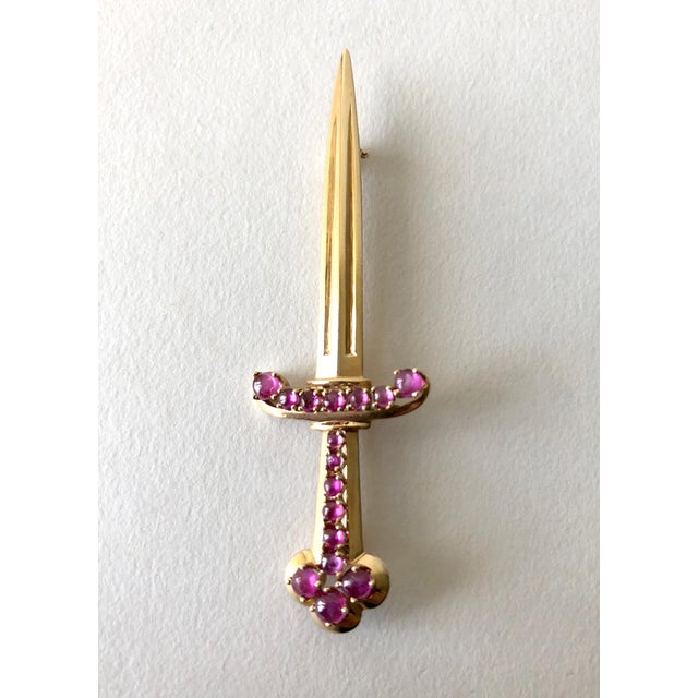 1950's 14K rose gold sword pin with ruby encrusted handle created by Paul Lackritz Jewelers of Beverly Hills. Brooch...