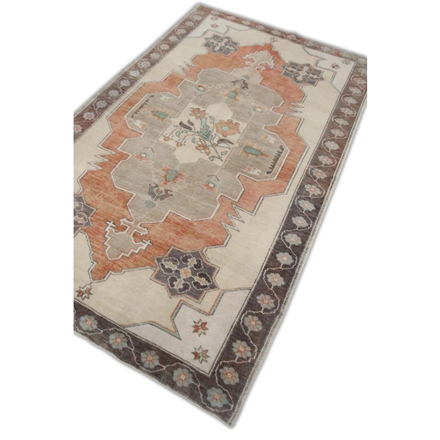 Introducing a one-of-a-kind vintage Turkish hand-knotted wool rug, carefully crafted by skilled artisans using traditional...