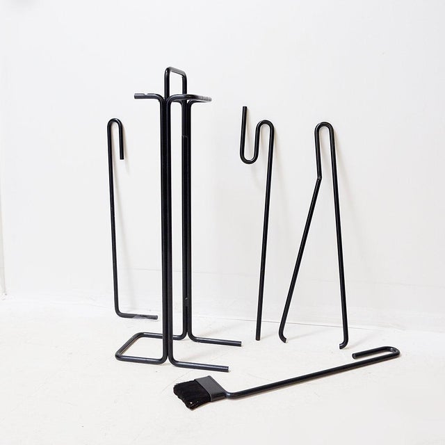 Minimalist - Modern fire set Measures : 16x27,5cm H:67cm This minimal black metal fire set is a great Dutch design of Ann...