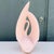Sculptural vintage Haeger ceramic swan featuring a dramatic Postmodern form and soft blush pink glossy glaze. The stylized...