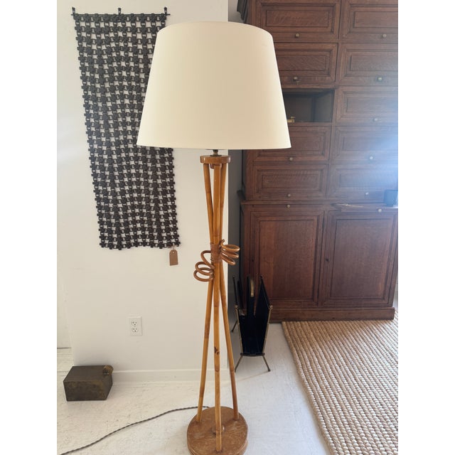 Mid Century French bamboo and rattan floor lamp. This bamboo floor lamp has been newly re wired to operate in the US, and...