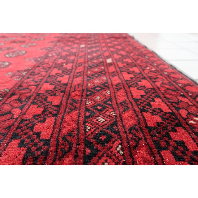 Antique Afghan Ersari Rug from the 1920s A magnificent antique Afghan Ersari rug from the 1920s, showcasing the refined...